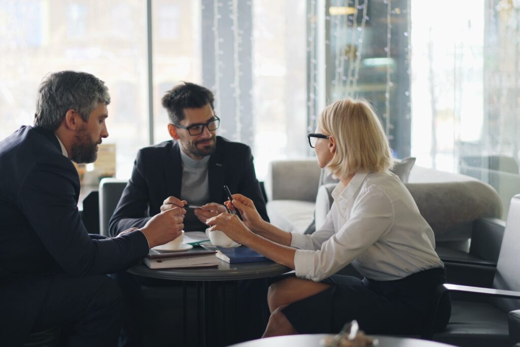 a group of people sitting around a table